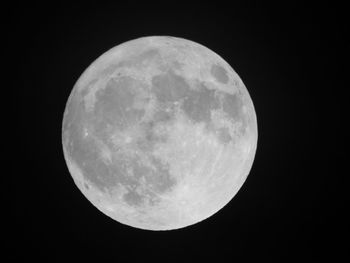 Low angle view of moon against clear sky at night