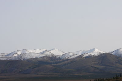 Scenic view of snowcapped mountains against clear sky