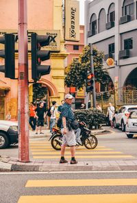 Man riding bicycle on city street