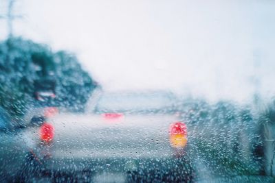 Raindrops on car window during rainy season