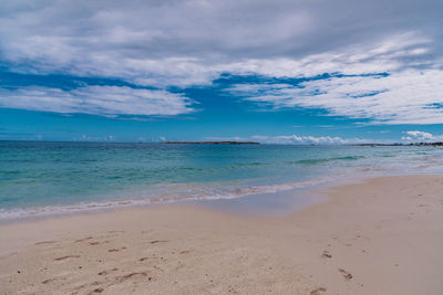 Scenic view of beach against sky