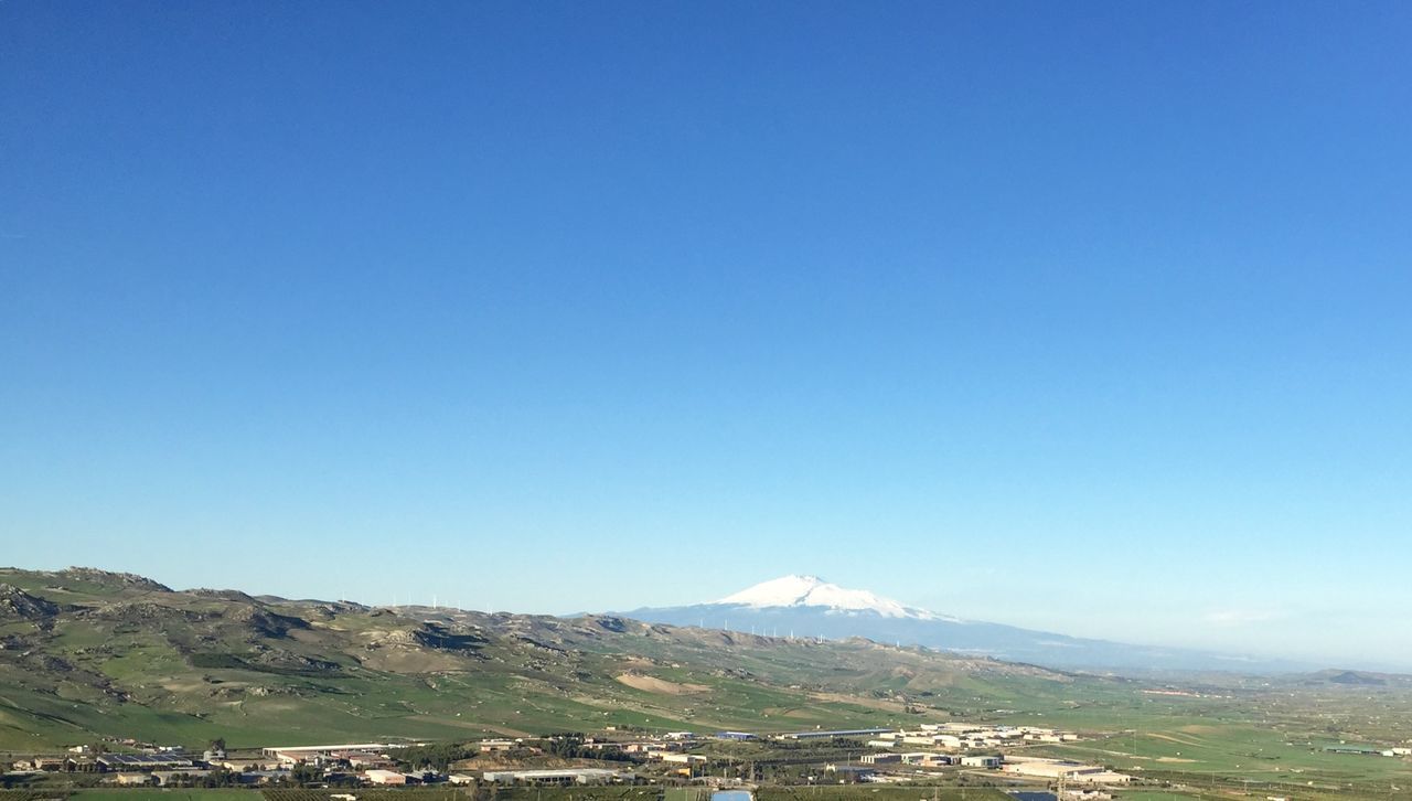 mountain, clear sky, copy space, tranquil scene, tranquility, landscape, scenics, blue, mountain range, beauty in nature, nature, non-urban scene, idyllic, remote, day, outdoors, no people, tree, hill, non urban scene