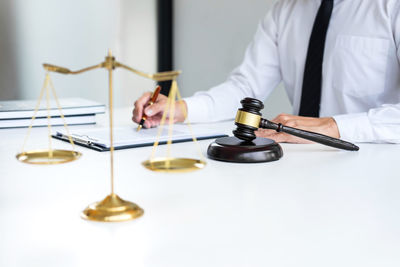 Midsection of man playing with table