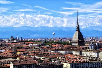 Aerial view of townscape against sky