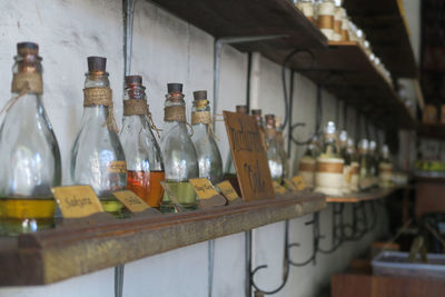 Row of wine bottles on table