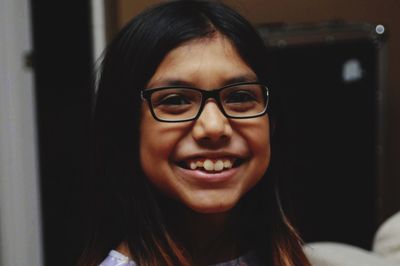 Close-up portrait of a smiling young woman