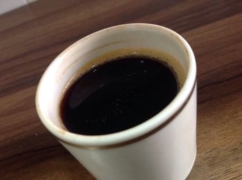 High angle view of black coffee on table