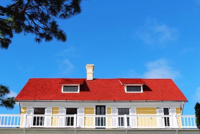 Low angle view of building against blue sky