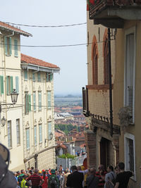 People in city against sky