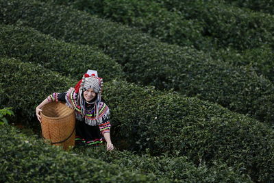 Portrait of farmer in traditional clothing working at farm