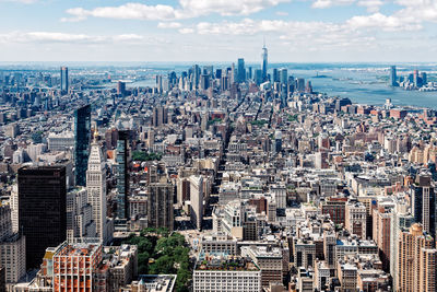 Aerial view of modern buildings in city against sky