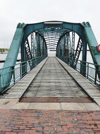 Bridge against sky in city