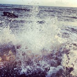 Waves splashing on rocks