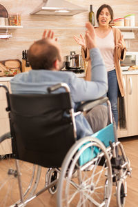 Rear view of couple sitting on seat