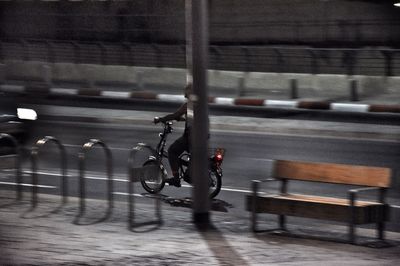 Man with bicycle on road