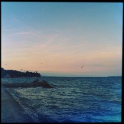 Scenic view of sea at sunset