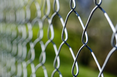 Full frame shot of chainlink fence against sky