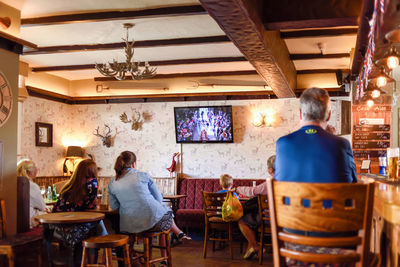 Rear view of people sitting in restaurant