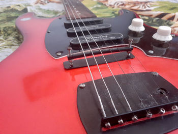 High angle view of guitar on table