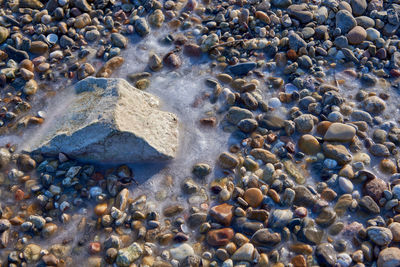 High angle view of stones on beach