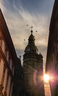 Low angle view of buildings against sky during sunset