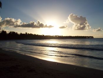 Scenic view of beach against sky during sunset