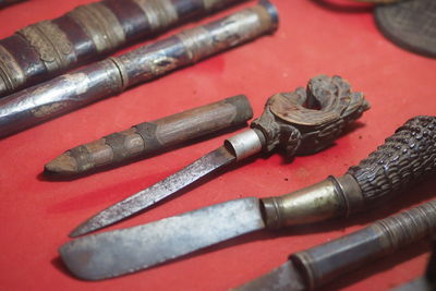 High angle view of equipment on red background