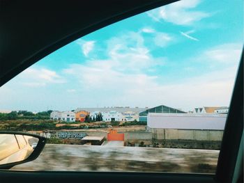 Reflection of sky seen through car window