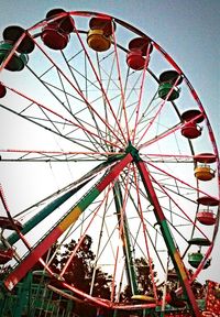 Low angle view of ferris wheel against sky