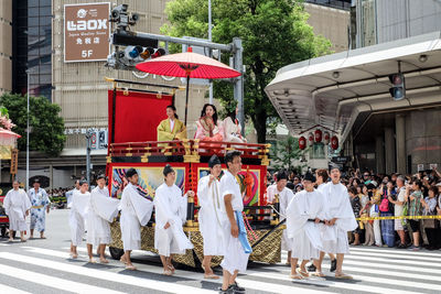 Group of people in traditional building in city