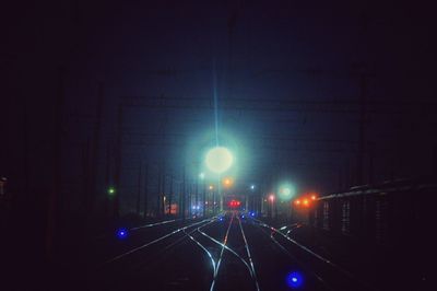 View of railway tracks at night