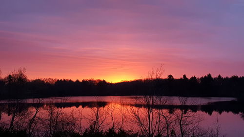 Scenic view of lake at sunrise