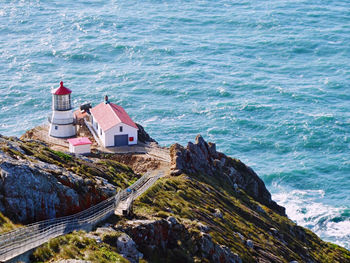 High angle view of buildings by sea