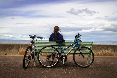 People riding bicycle on road