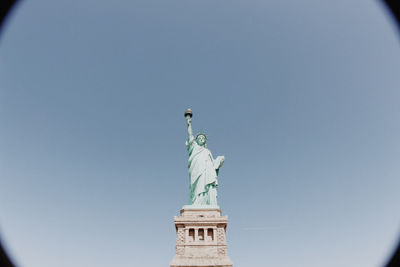 Low angle view of statue against sky