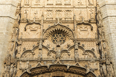 Low angle view of carvings on wall of building