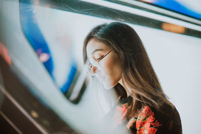 Portrait of woman looking down