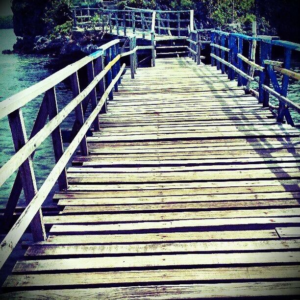 the way forward, railing, built structure, water, diminishing perspective, architecture, pier, footbridge, wood - material, connection, boardwalk, vanishing point, sea, leading, narrow, steps, long, no people, bridge - man made structure, wood