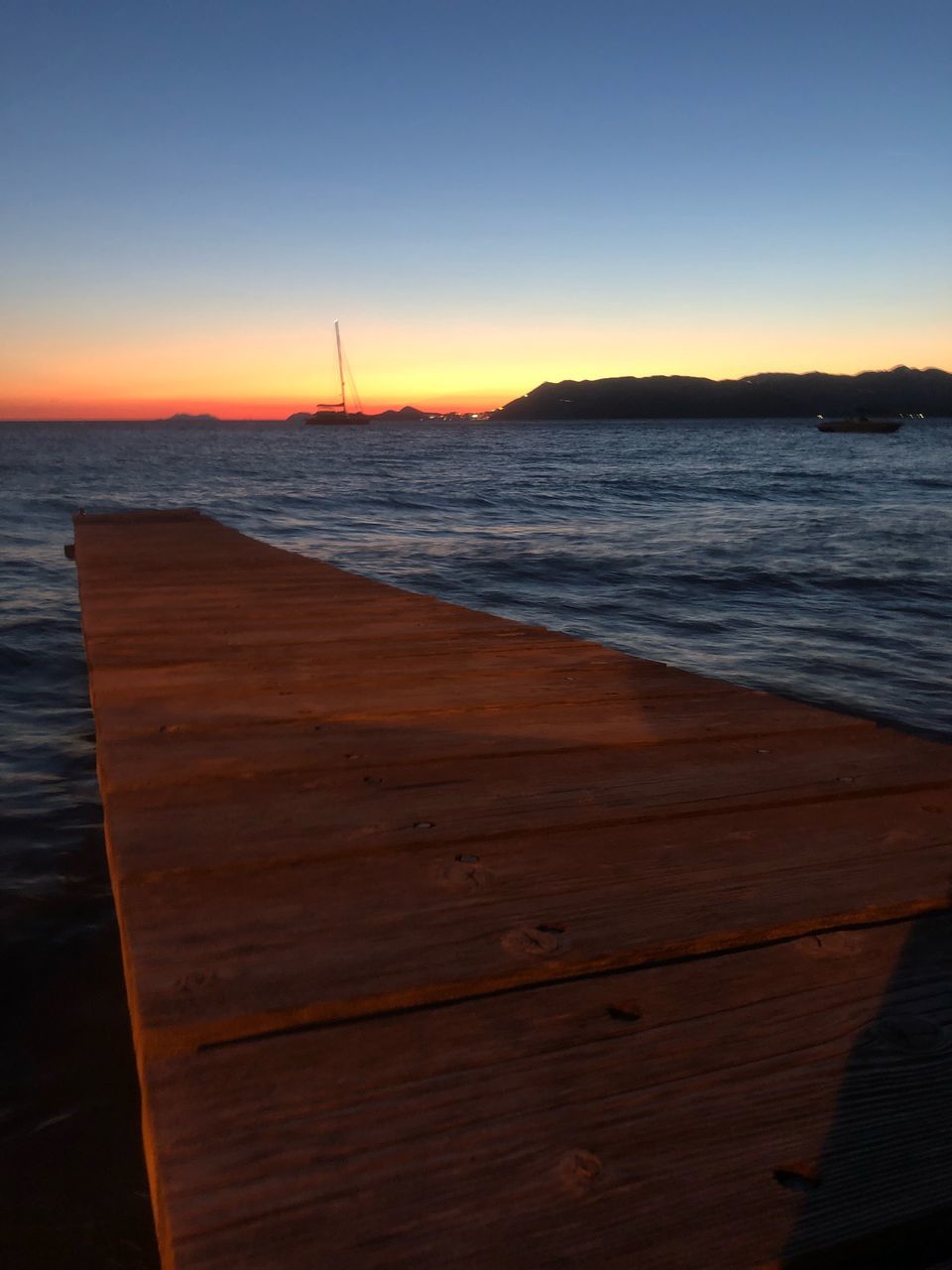 SCENIC VIEW OF BEACH DURING SUNSET