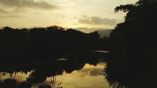 Scenic view of lake at sunset