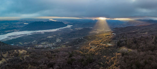 Aerial view of landscape against cloudy sky