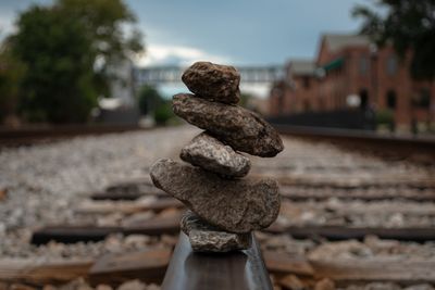 Close-up of a rock stack on top of a railway