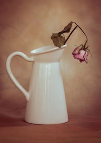 Close-up of white flower vase on table