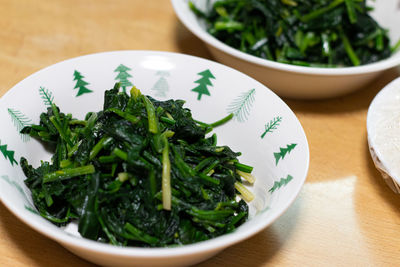 High angle view of chopped vegetables in bowl on table