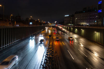 High angle view of light trails on city street at night