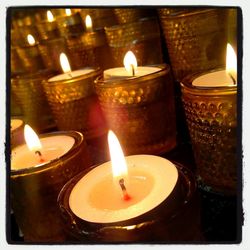 Close-up of illuminated tea light candles