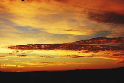 Scenic view of dramatic sky during sunset