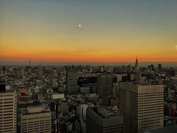 Cityscape against sky during sunset