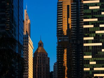 Low angle view of buildings in city against sky