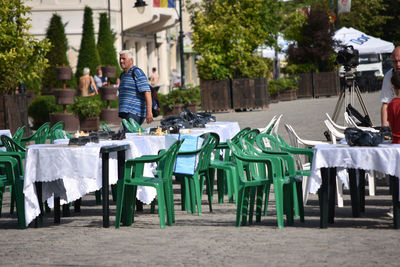 Empty chairs in park